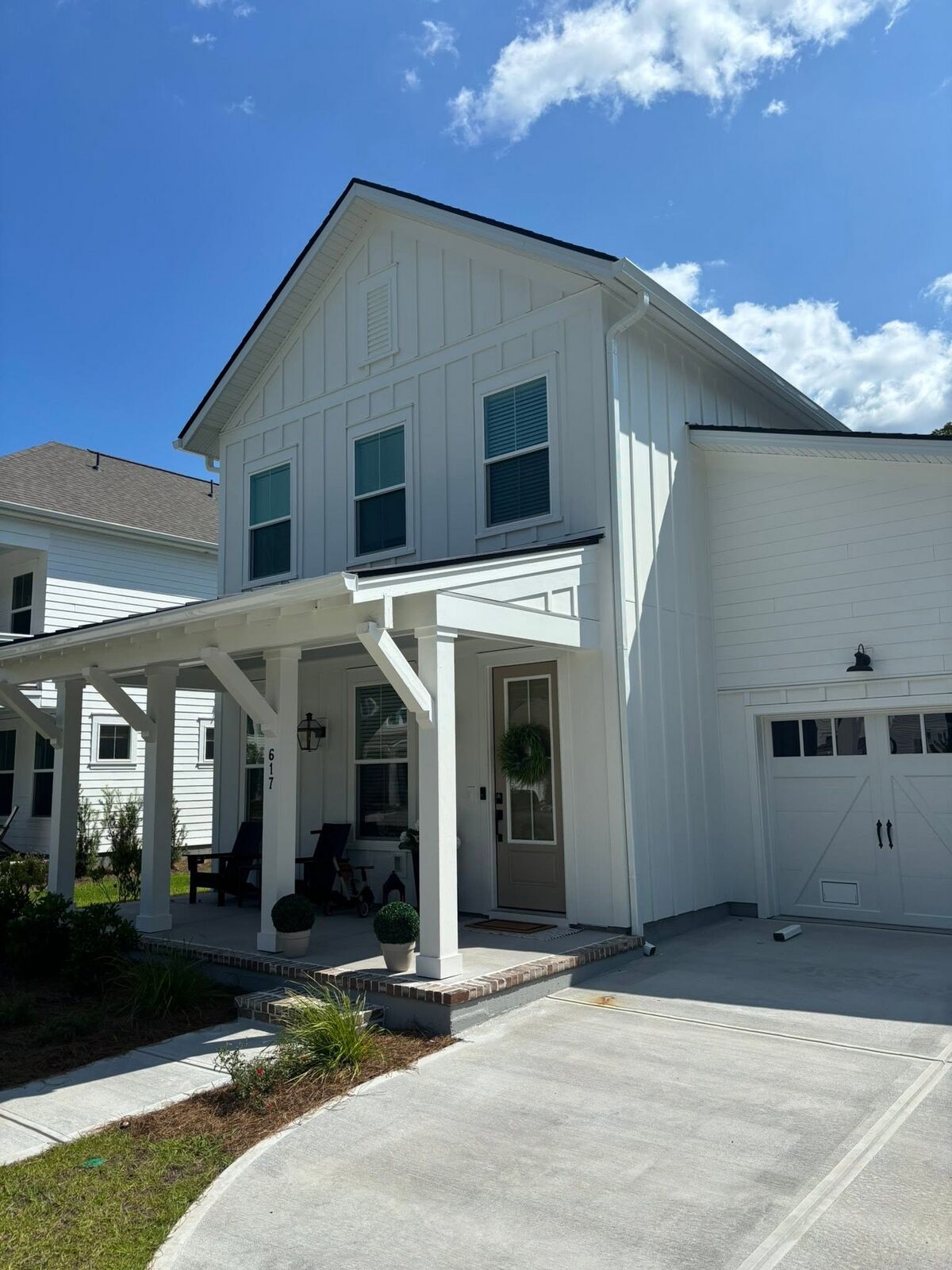Clean white seamless gutters on a two-story modern farmhouse